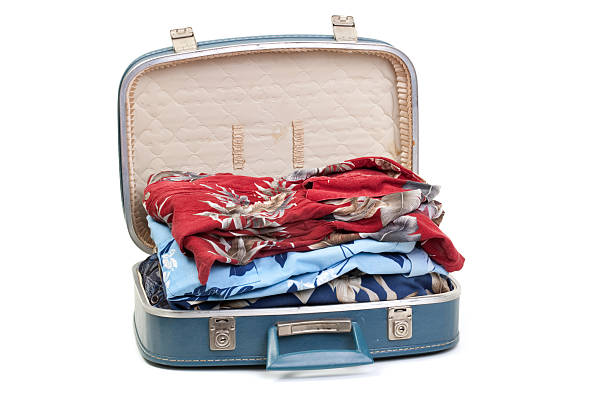 istock Blue suitcase full of clothes 174690342