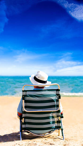 istock Man on Holiday relaxing in a beach chair 174690886