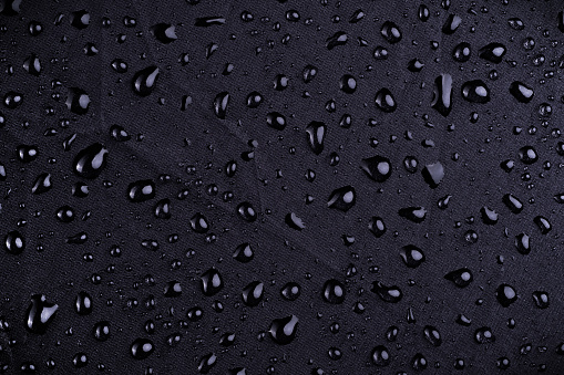macro view of water drop on a waterproof nylon textile from a umbrella