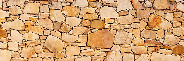 Sandstone Brick Wall Texture A high resolution sandstone wall texture made from several different photos stitched together to form one huge image. sand stone wall stock pictures, royalty-free photos & images