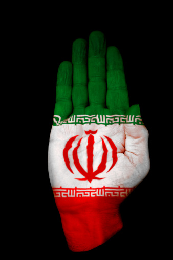 Image of a hand with the flag of Iran on it.