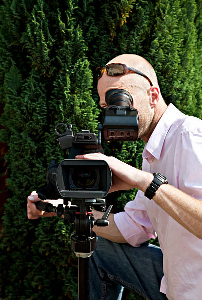 istock cool man making a movie, filming 174691935