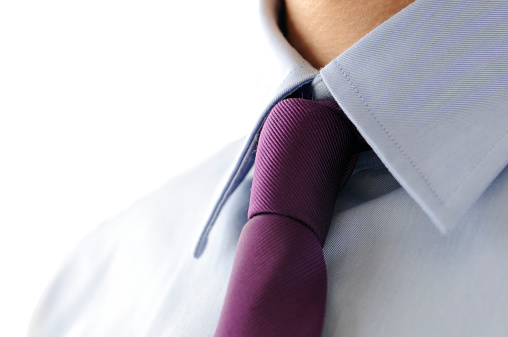 Detail of the lilac tie and blue button down shirt, isolated on white background. Convert from RAW. Nikon D300, Nikkor 105mm f/2.8G ED.