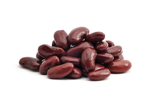 A close up shot of a pile of Kidney Beans isolated on white.