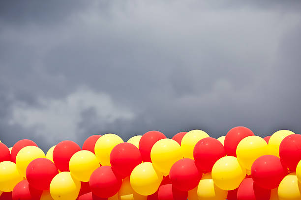 Hot air balloon with bright burning flame flying in the night.