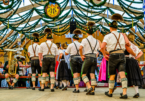 Munich, Germany - September 24: typical bavarian dancers in traditional clothing at the Oktoberfest in Munich on September 24, 2023