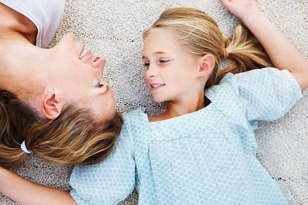 istock Mother lying with her daughter 174693254