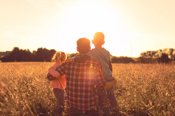 istock Family in the meadow at sunset. 1746932856