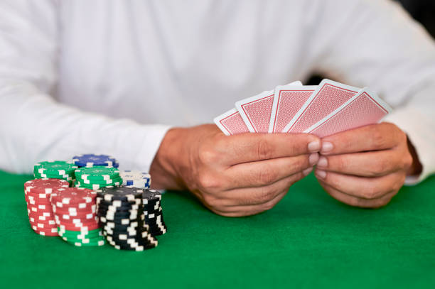 istock Man with casino cards and betting chips 1746934039