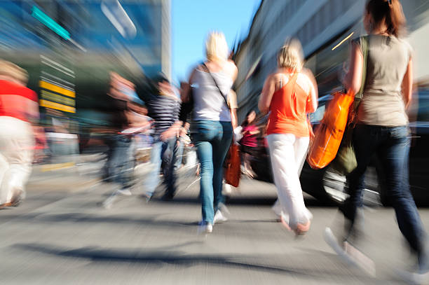 istock Young people crossing street, motion blur 174693500