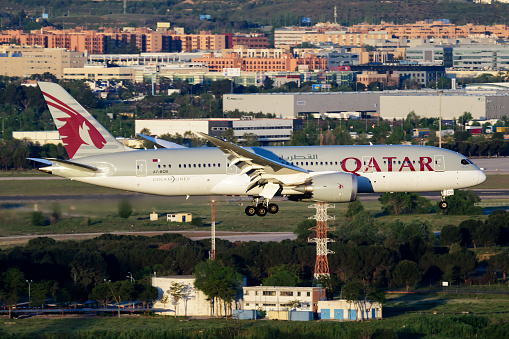 Madrid, Spain - May 4, 2016: Qatar Airways passenger plane at airport. Schedule flight travel. Aviation and aircraft. Air transport. Global international transportation. Fly and flying.