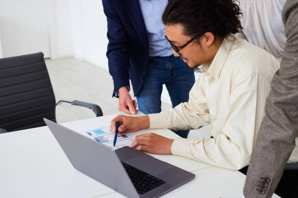 istock Businessman explaining project ideas to colleagues in office 1746936265