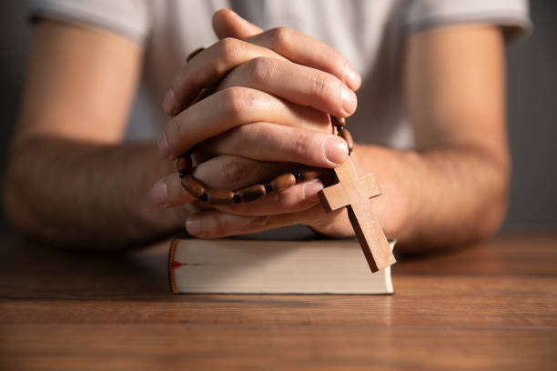 istock young man with bible on wooden table indoors. space for text 1746936828