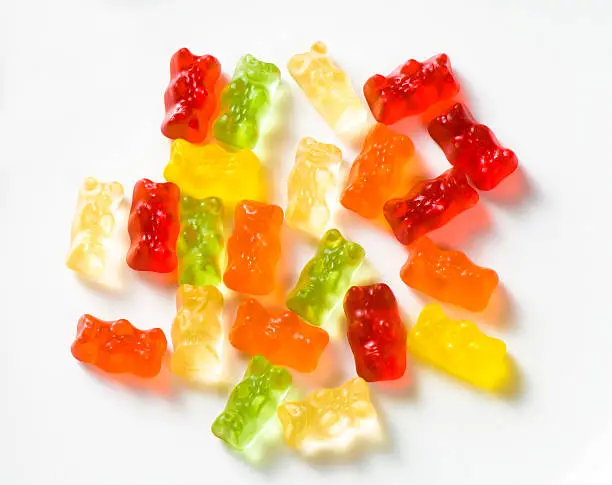 Gummy bears. Brightly colored candy in teddy bear shape on white background