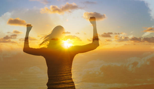 istock Confident, strong woman against sunset background. 1746939075