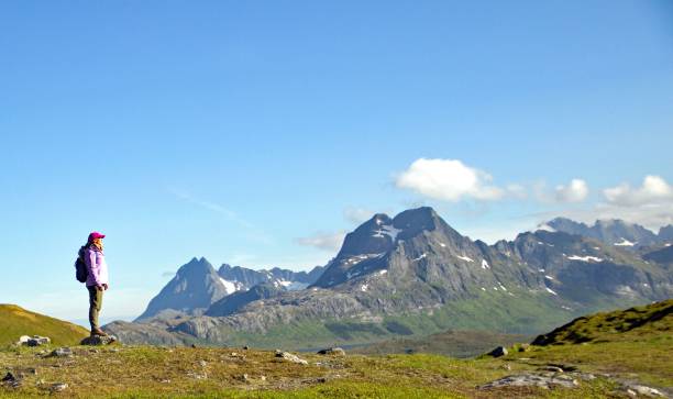 istock Tourist looking at the beautiful mountain landscape 1746941242