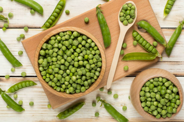 istock Composition with fresh green peas on wooden background, top view 1746942901