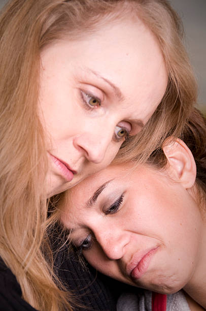 istock Consoling Teen Daughter 174694378