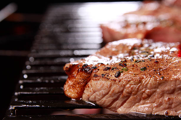 Close up of tender beef steaks on the BBQ grill.Click Images To View My BBQ Lightbox
