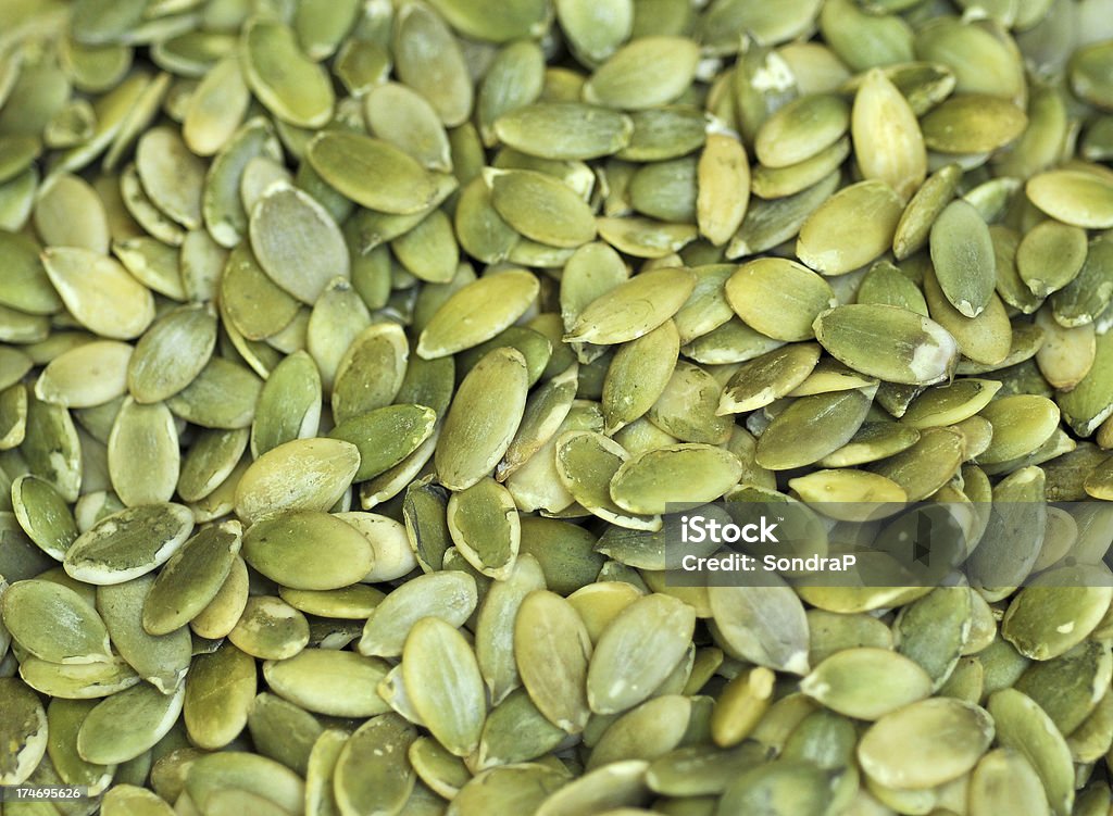 Roasted Pumpkin Seeds "Full frame of pumpkin seeds, roasted. FOR MORE FOOD, (" Backgrounds Stock Photo