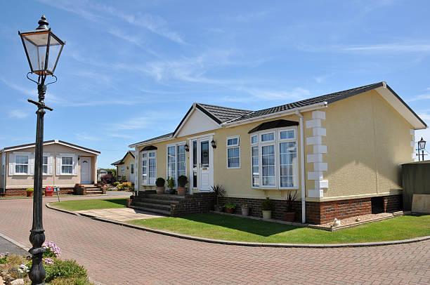 Fancy residential mobile home on beautiful property Residential mobile home park in South East England.  Generally this type of caravan park estate is for home owners over the age of fifty years. prefabricated building stock pictures, royalty-free photos & images