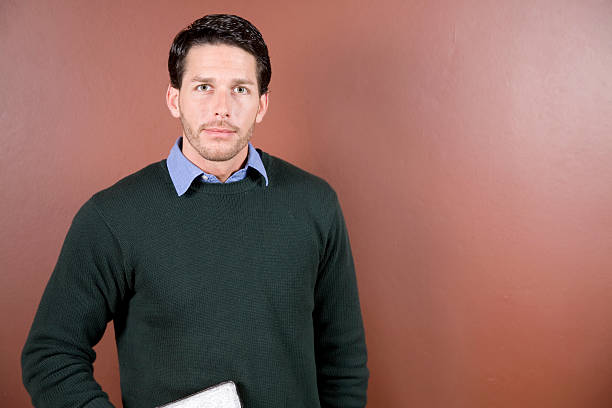 istock Attractive Man Standing Holding His Bible With Copy Space 174696155