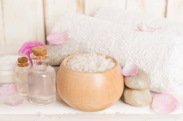 istock Spa composition with pink roses on wooden table 1746966501
