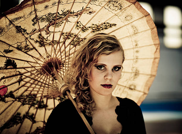 istock young woman under a chinese umbrella 174696929