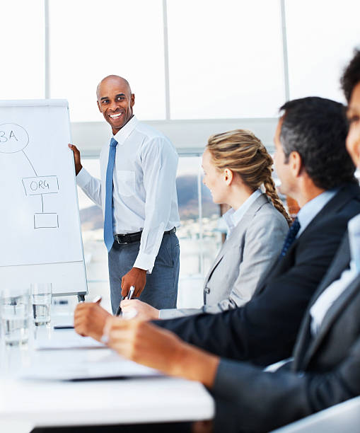 istock Businessman giving a presentation to his coworkers 174697155