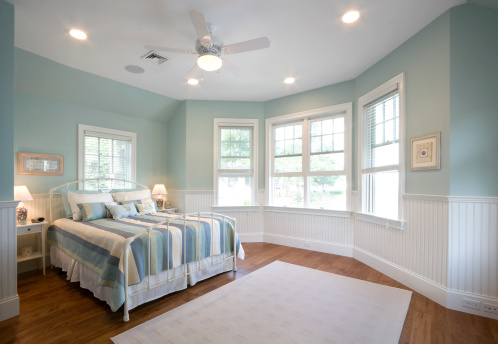 The master bedroom of a beautiful beach cottage.