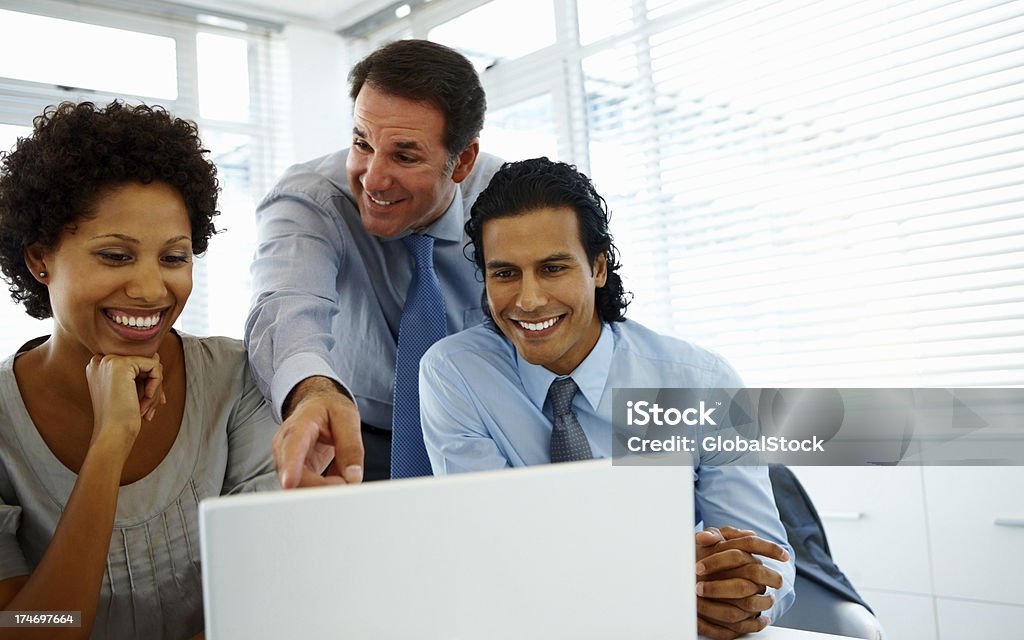 Group of business people working together Group of business people working together and smiling 20-24 Years Stock Photo