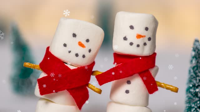 Two Happy Marshmallow Snowmen in the Falling Snow