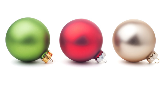 Colorful Christmas ornaments, green, red, and gold; isolated on white with soft shadow and clipping paths.