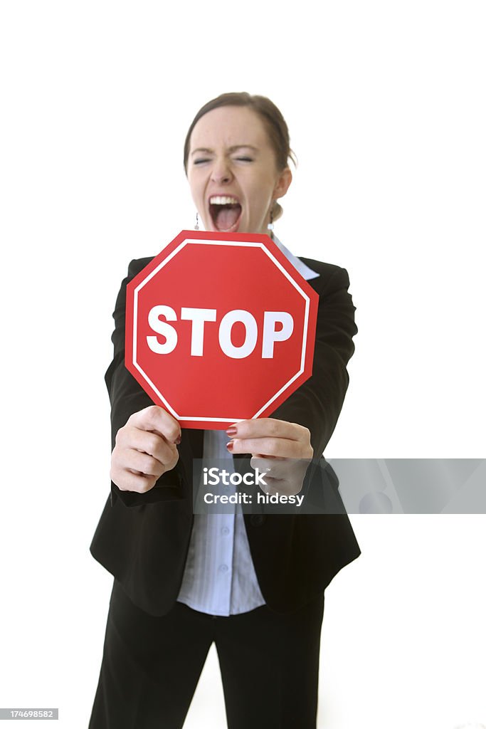 Screaming business woman and red stop sign "Screaming business women, holding a red stop sign." Holding Stock Photo