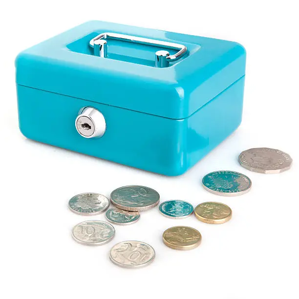 Locked cash box with assorted Australian coins at the front