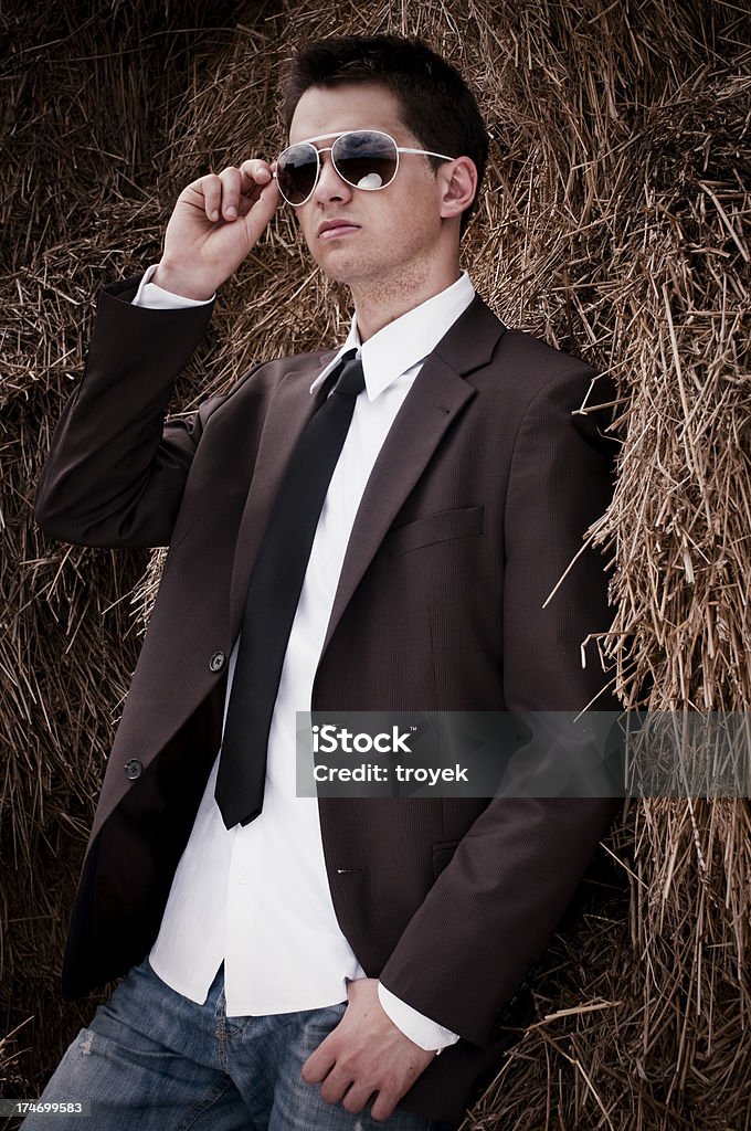 portrait of a young businessman in field Adult Stock Photo