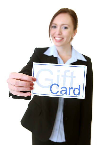 istock Business woman holding a gift card 174699816