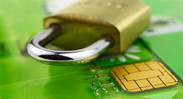 A close-up of a bank chip card with a lock on it stock photo