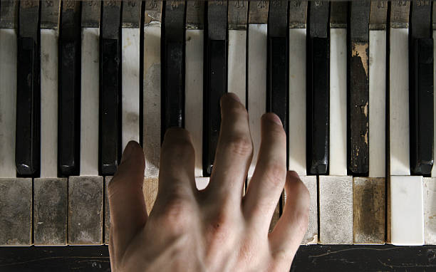 Piano Chipped and Broken with Hand