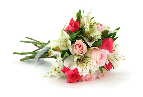 Beautiful bouquet with roses, carnations, iris and eucalyptus on a pink background, copy space. Mothers day, 8 march, holiday gift concept