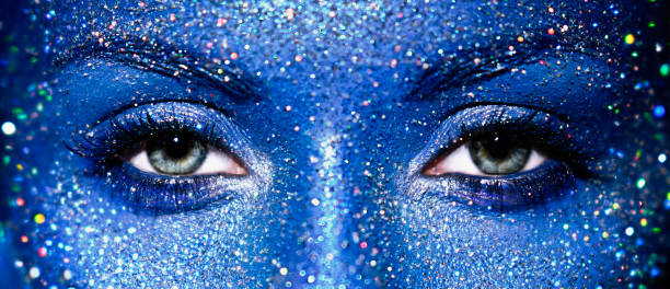 istock Beautiful female eyes with sparkles on her face 1747012898