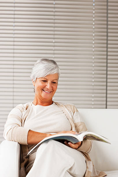 istock Senior woman reading a book 174701396