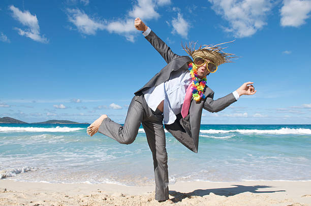 istock Wild and Crazy Tourist Businessman Dancing Outdoors on Beach 174701921
