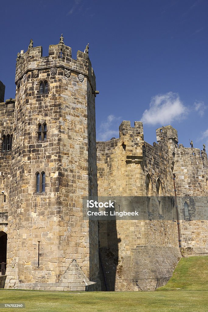 Alnwick Castle "Alnwick Castle is a castle and stately home in Alnwick, Northumberland, England and the residence of the Duke of Northumberland, built following the Norman conquest, and renovated a number of times. The movies Blackadder and Harry Potter were filmed here." Alnwick Castle Stock Photo