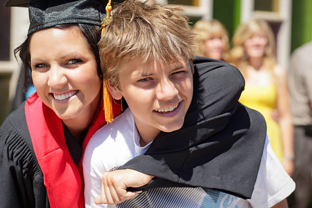 istock Female Graduate with Brother 174702700