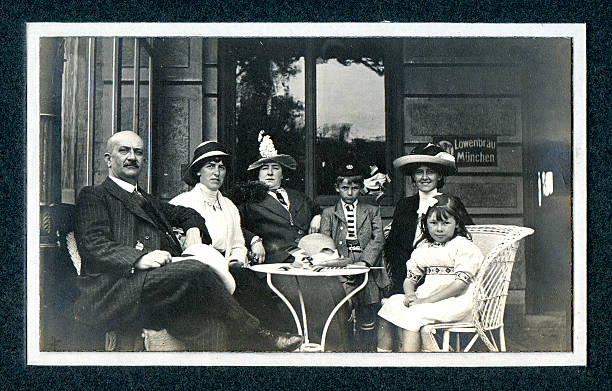 Edwardian Family at Cafe - Vintage Photograph "Vintage photograph of an Edwardian family on a day out at a cafe. Knokke, Belgium." belgium photos stock pictures, royalty-free photos & images