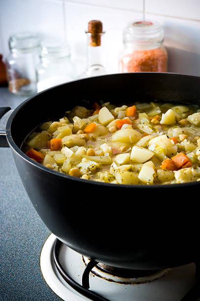 istock Vegetable soup cooking stock pot gas stove 174703136