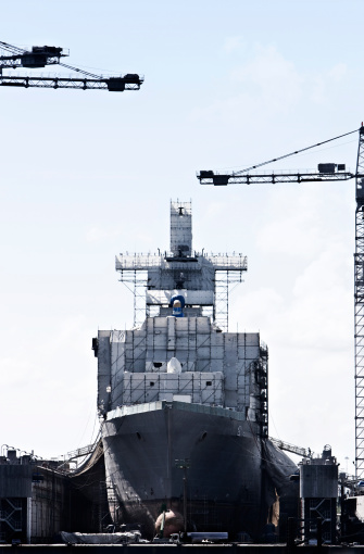 Military ship in the process of being built at shipyard in Norfolk, VA, USA.