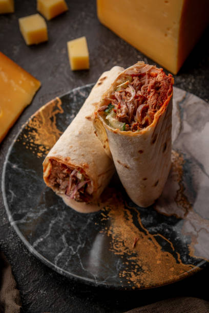 istock Shawarma in a plate on a dark background 1747035277