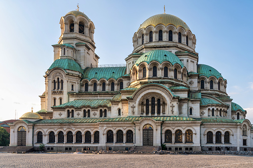 A stunning shot of the Alexander Nevsky Cathedral, one of Sofia's most iconic landmarks, displaying its neo-Byzantine architecture, golden domes, and intricate details, standing as a testament to Bulgaria's rich history and religious heritage.